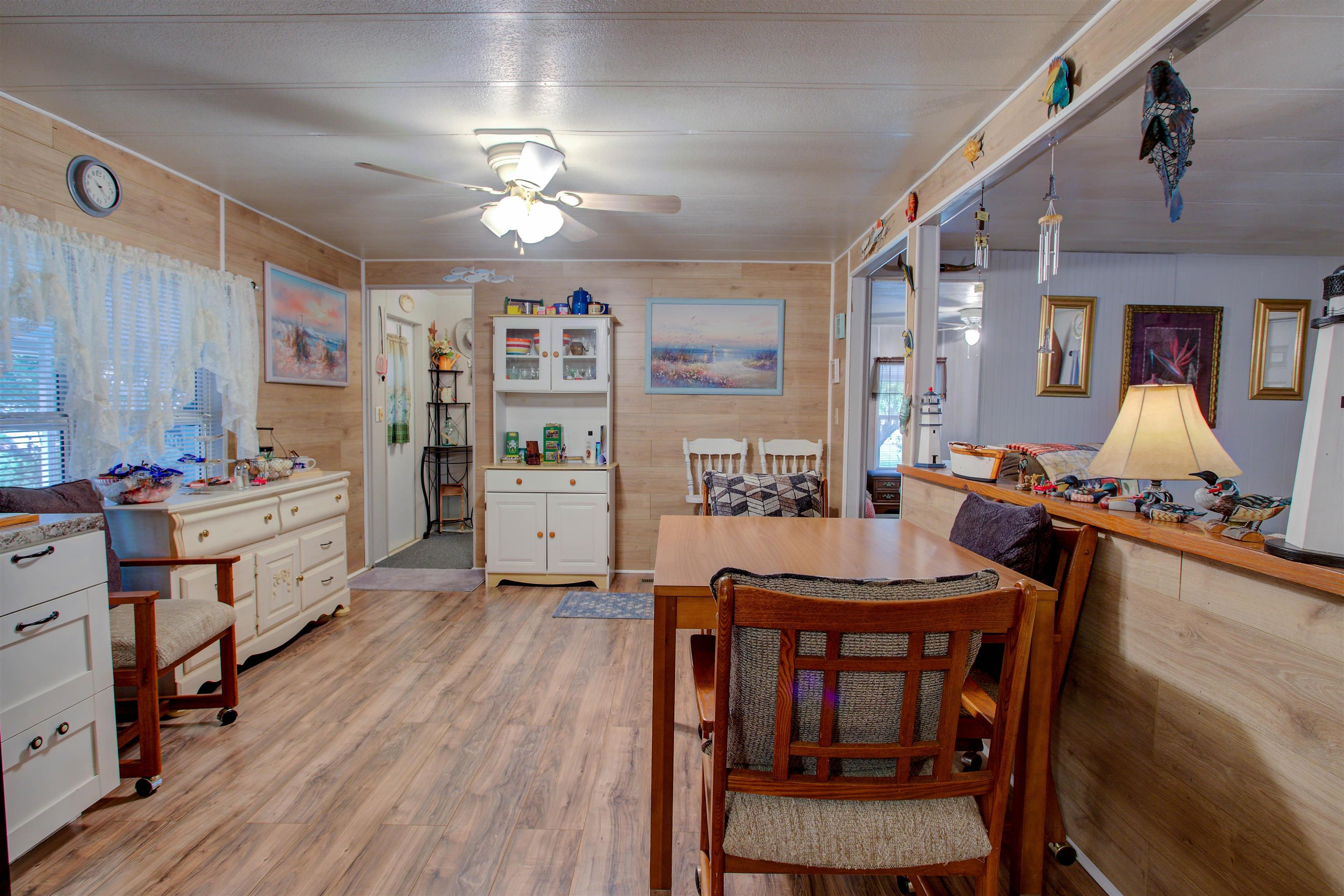 736 San Mateo Road Satsuma, FL 32189 - Photo 7 of 41 a view of a dining room with furniture and wooden floor