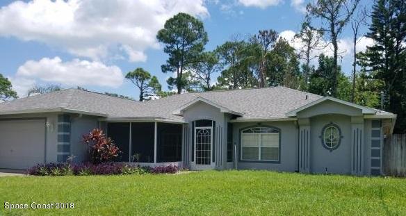 6157 Dees Road Cocoa, FL 32927 - Photo 1 of 20 a front view of a house with garden
