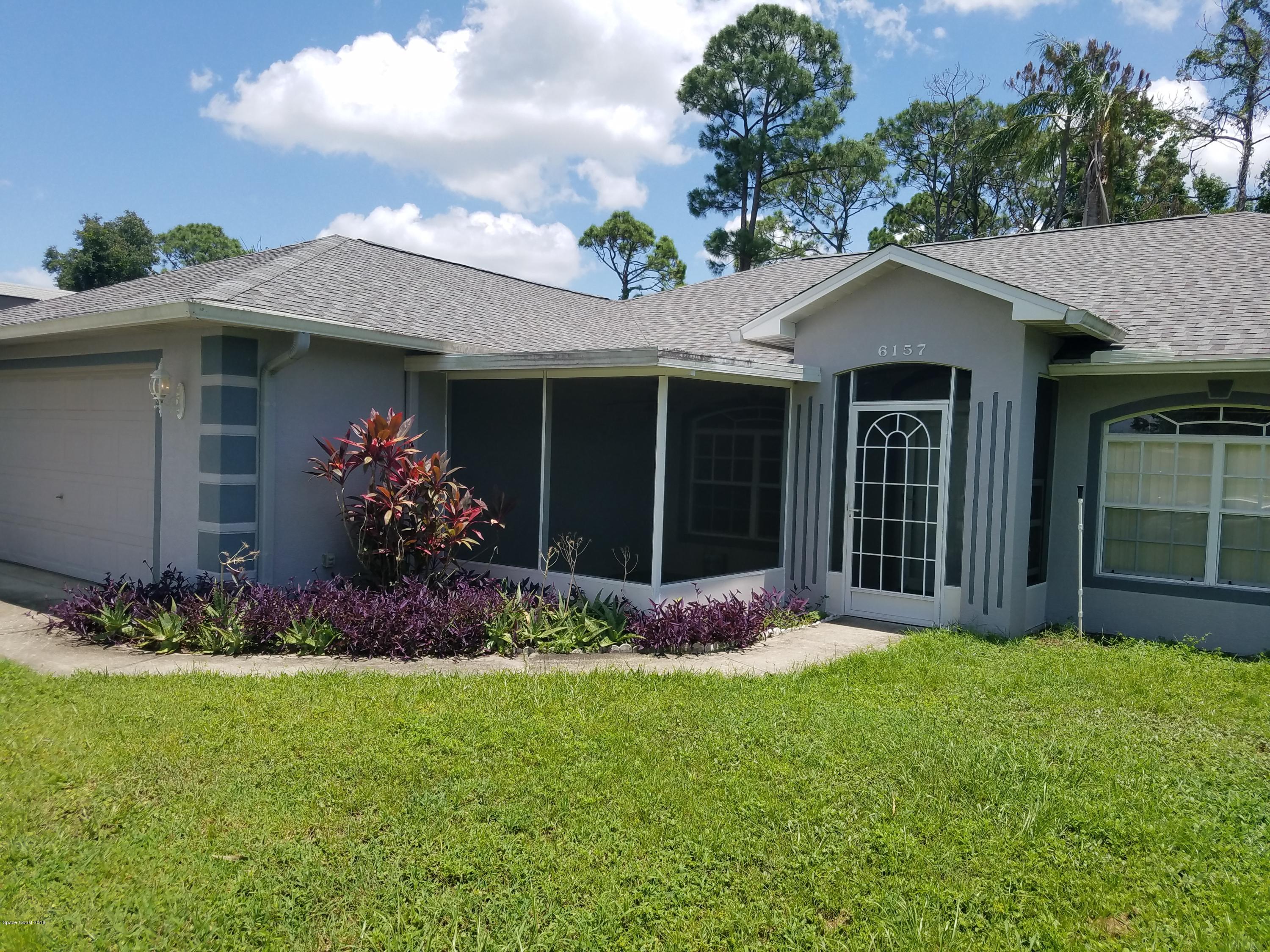 6157 Dees Road Cocoa, FL 32927 - Photo 2 of 20 a front view of a house with a yard