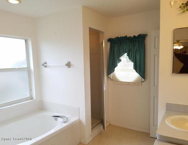6157 Dees Road Cocoa, FL 32927 - Photo 13 of 20 a bathroom with a tub