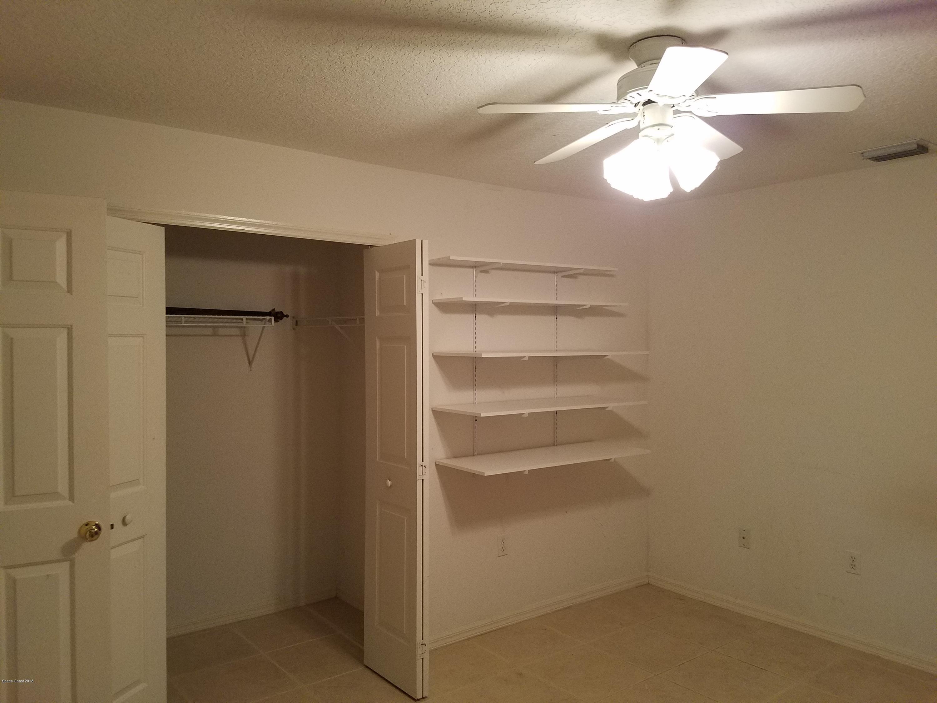 6157 Dees Road Cocoa, FL 32927 - Photo 16 of 20 a view of a room with rack on the wall