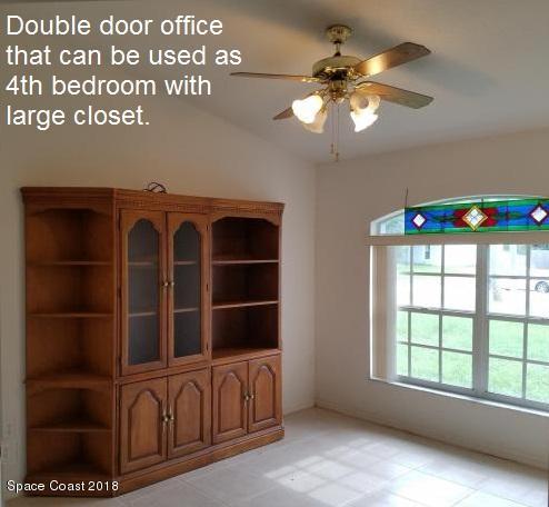 6157 Dees Road Cocoa, FL 32927 - Photo 18 of 20 a view of an empty room with a window