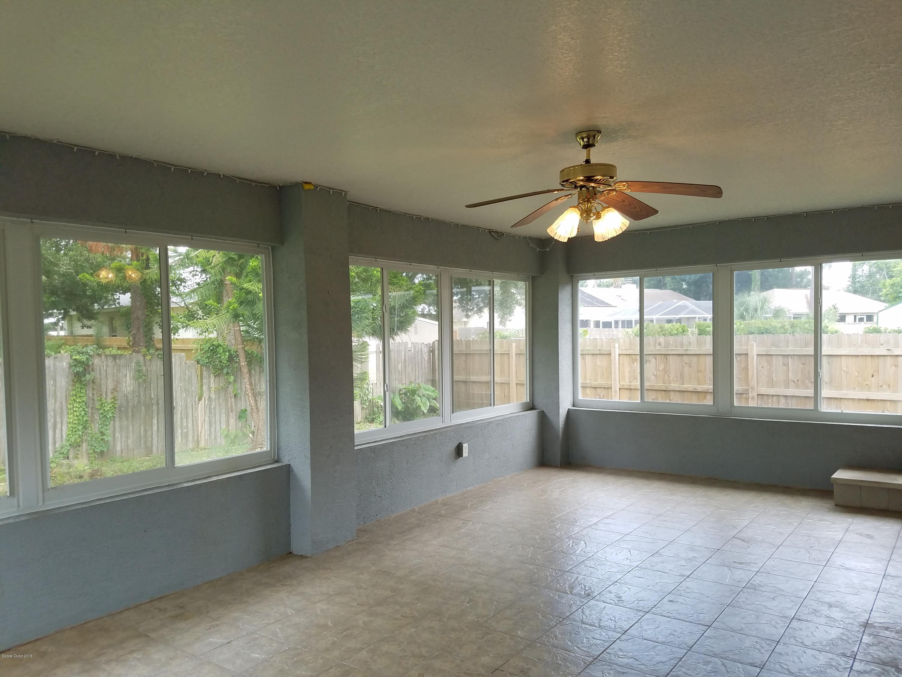 6157 Dees Road Cocoa, FL 32927 - Photo 19 of 20 a view of an empty room with a window
