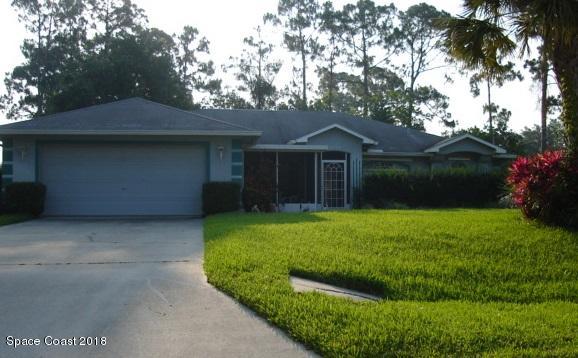 6157 Dees Road Cocoa, FL 32927 - Photo 20 of 20 a front view of a house with a garden