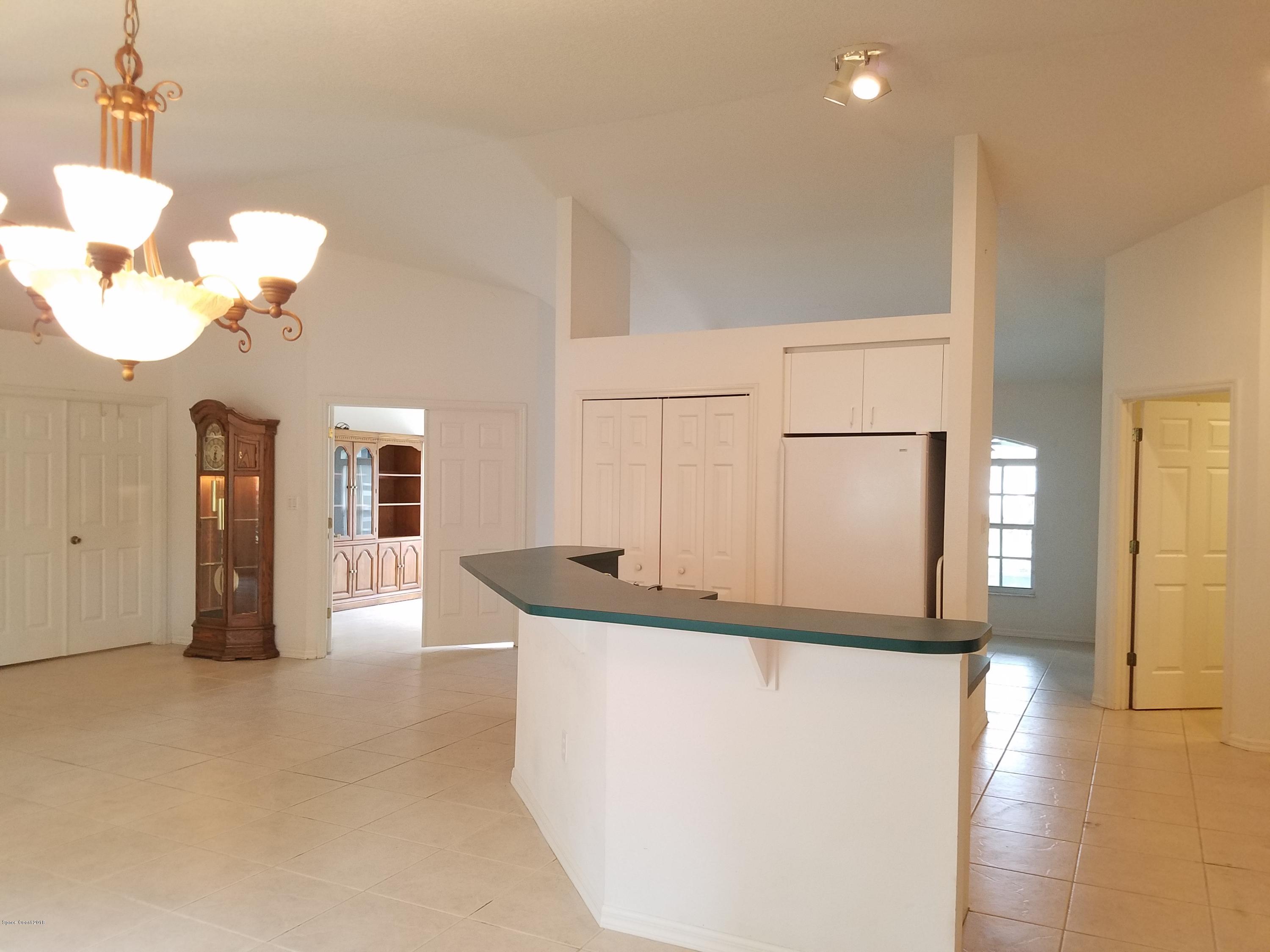 6157 Dees Road Cocoa, FL 32927 - Photo 3 of 20 a view of kitchen and living room