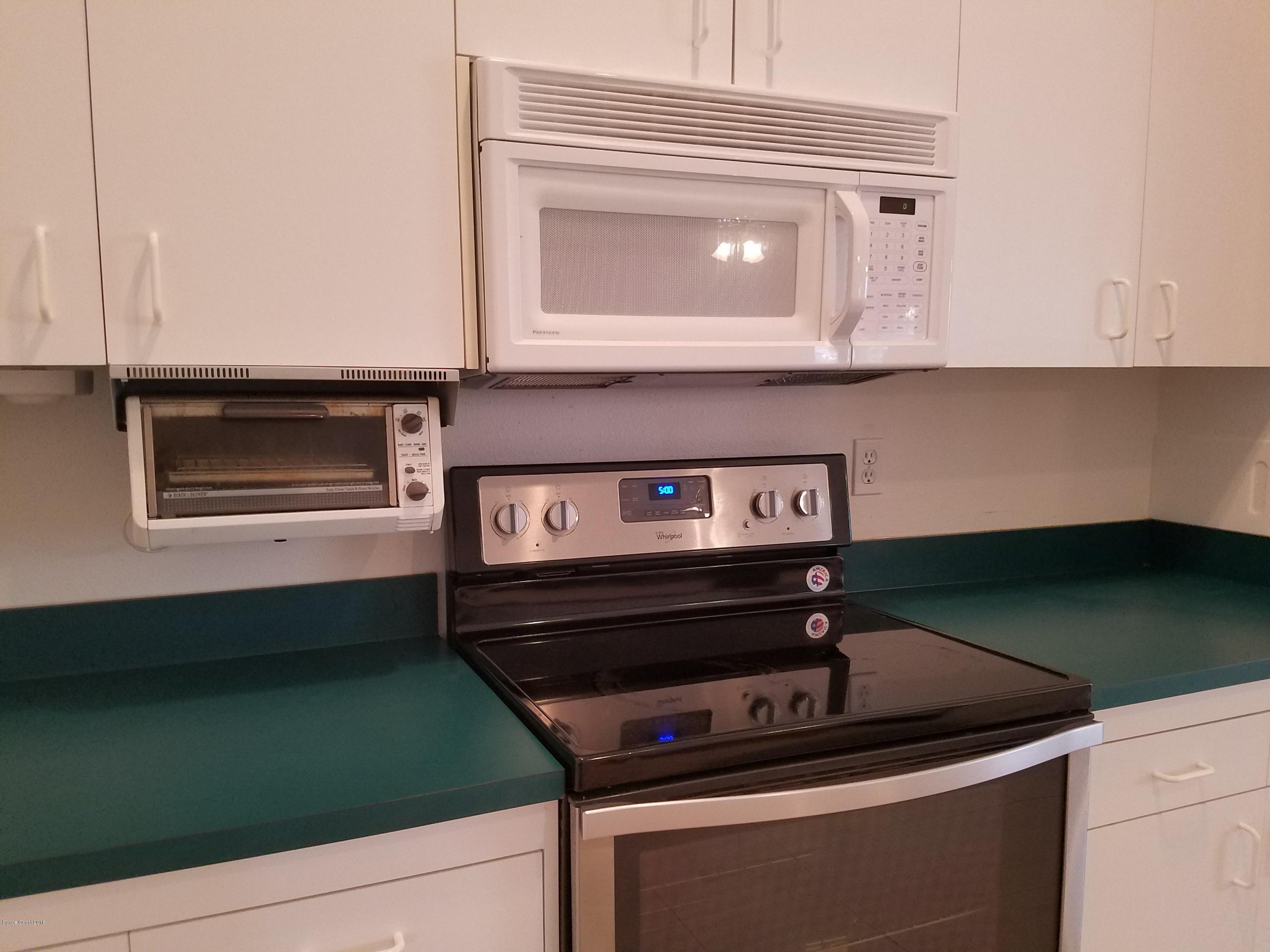 6157 Dees Road Cocoa, FL 32927 - Photo 6 of 20 a close view of a stove a sink and dishwasher