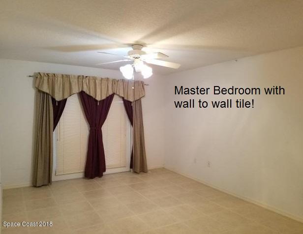 6157 Dees Road Cocoa, FL 32927 - Photo 9 of 20 a view of a ceiling fan and a projector