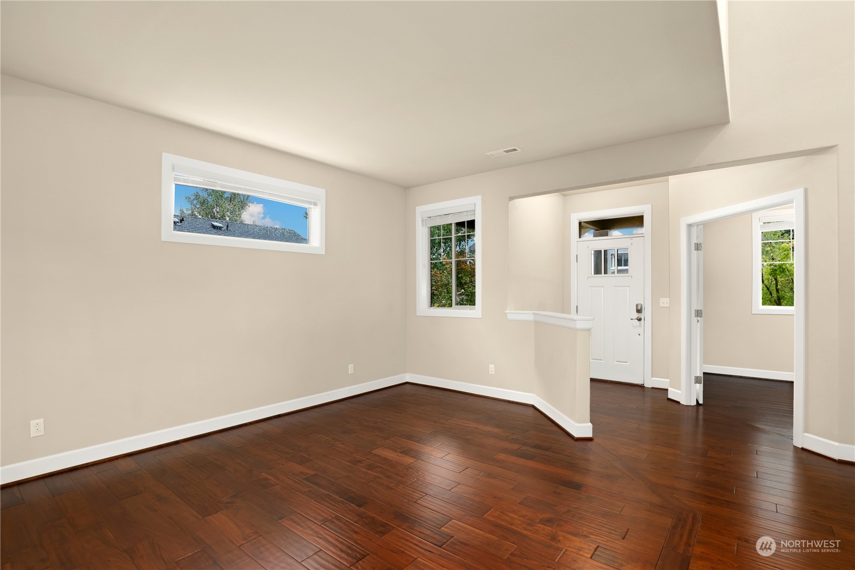1592 Ridgeview Loop Southwest Tumwater, WA 98512 - Photo 12 of 40 a view of an empty room with wooden floor and a window