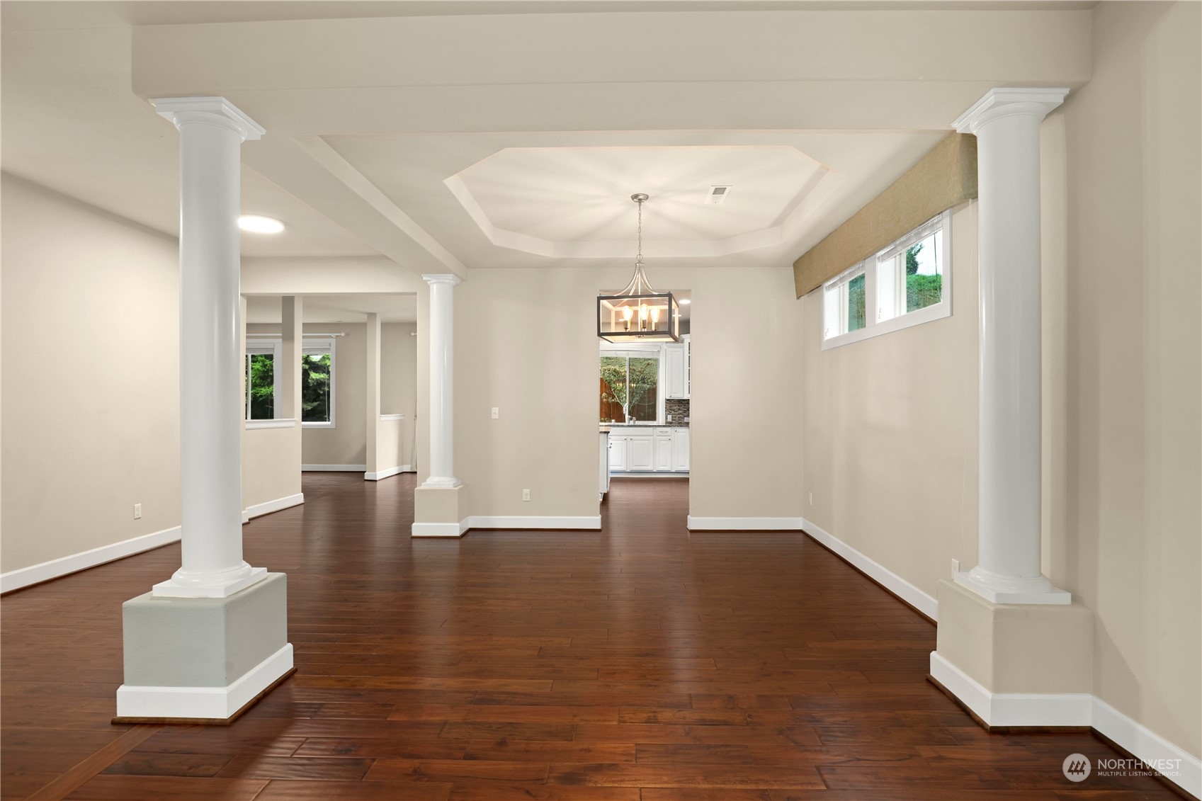 1592 Ridgeview Loop Southwest Tumwater, WA 98512 - Photo 14 of 40 a view of a livingroom with wooden floor and a hallway