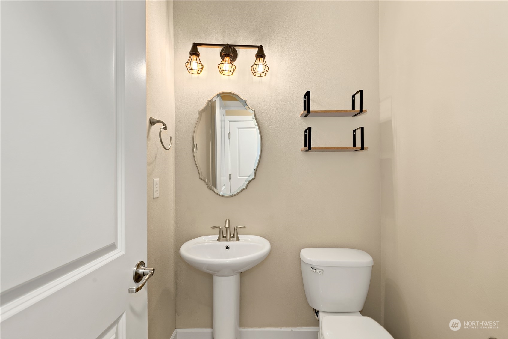 1592 Ridgeview Loop Southwest Tumwater, WA 98512 - Photo 17 of 40 a bathroom with a toilet sink and mirror