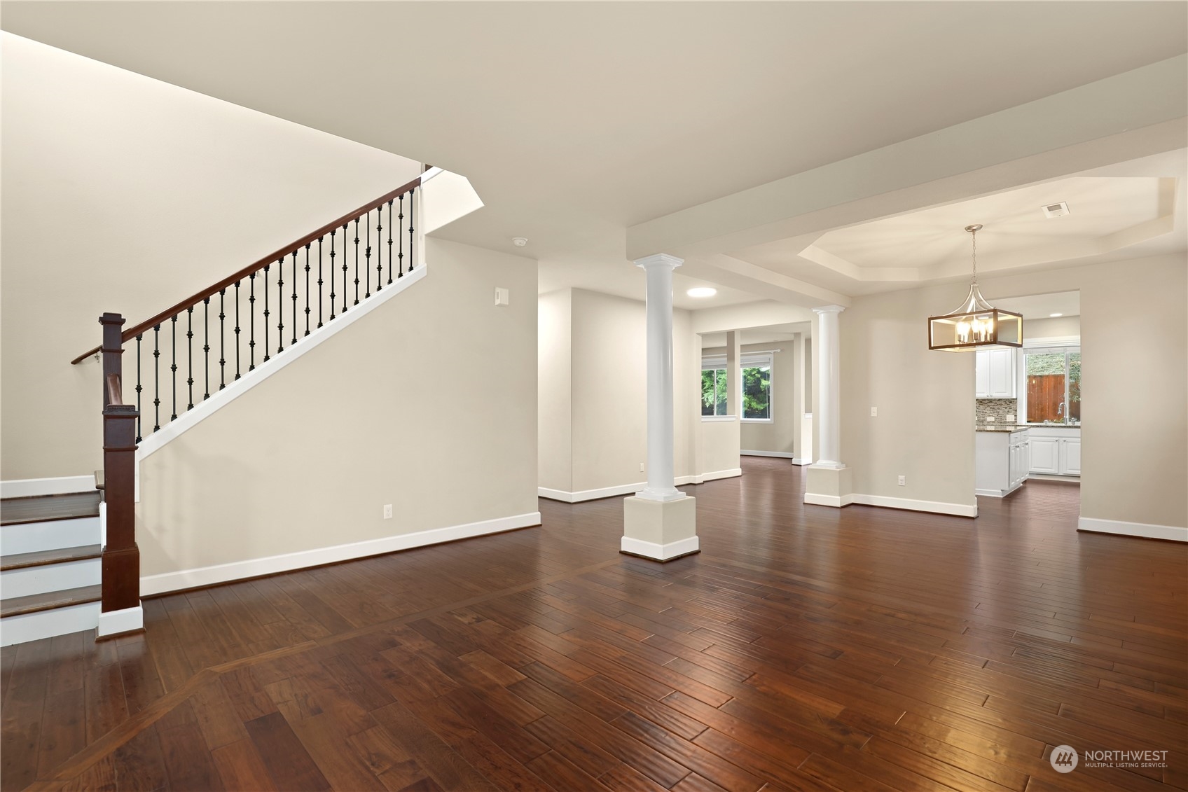 1592 Ridgeview Loop Southwest Tumwater, WA 98512 - Photo 18 of 40 a view of an empty room with wooden floor and a potted plant
