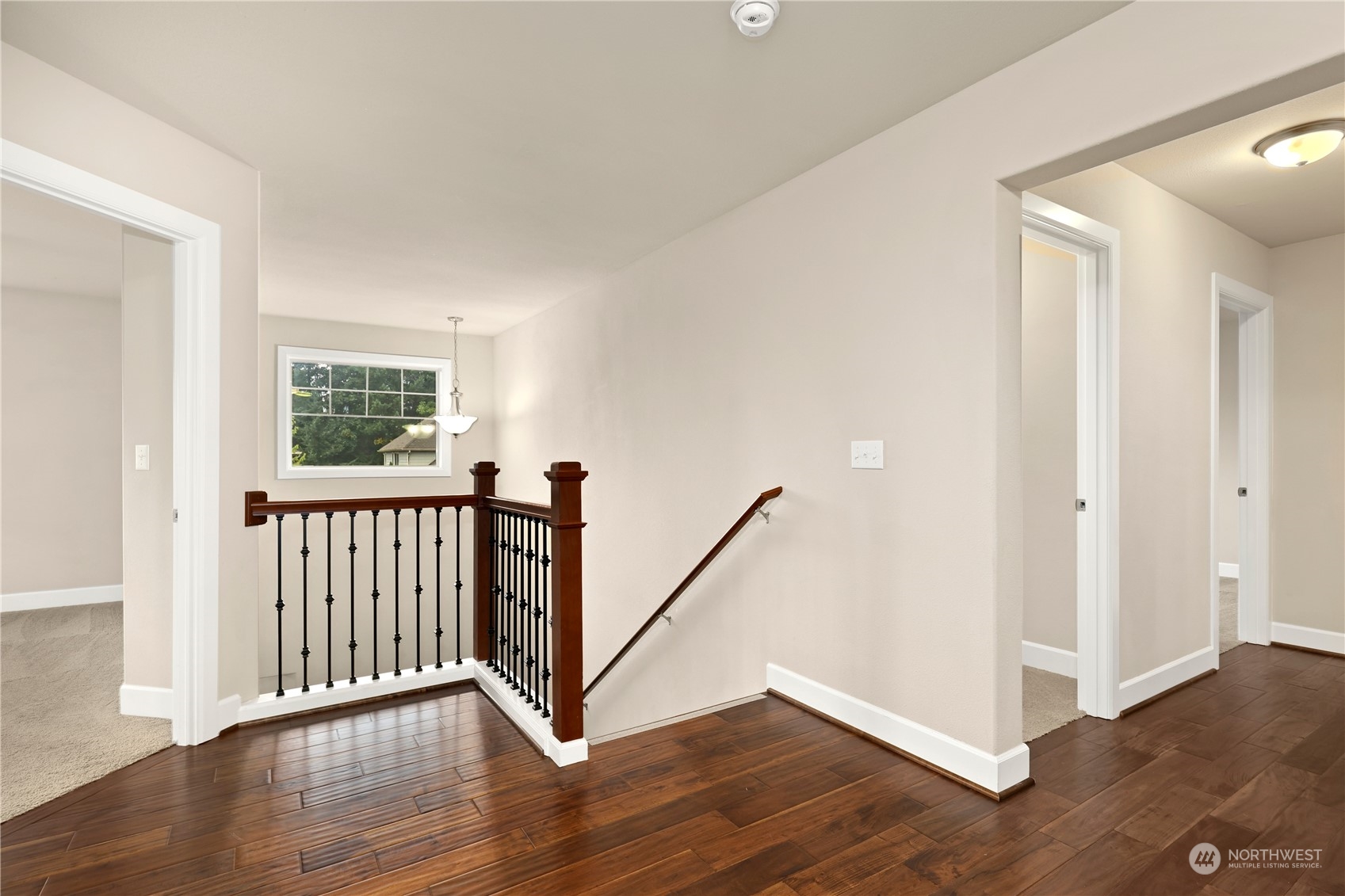 1592 Ridgeview Loop Southwest Tumwater, WA 98512 - Photo 19 of 40 a view of a hallway with wooden floor and stairs