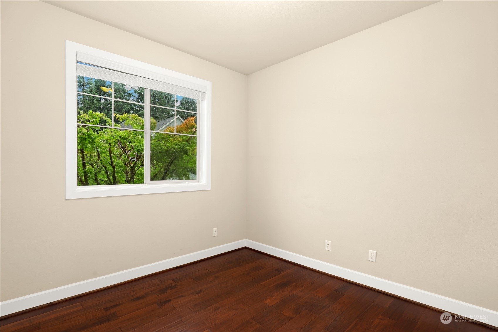 1592 Ridgeview Loop Southwest Tumwater, WA 98512 - Photo 20 of 40 an empty room with wooden floor and windows