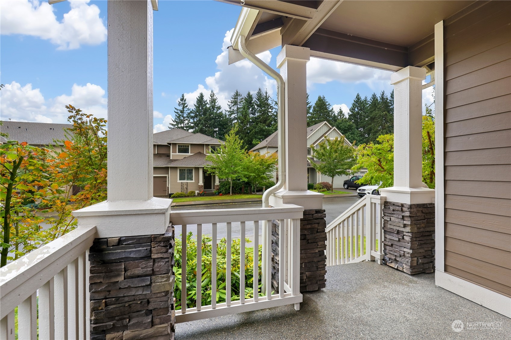 1592 Ridgeview Loop Southwest Tumwater, WA 98512 - Photo 2 of 40 a balcony with tall trees in front of it