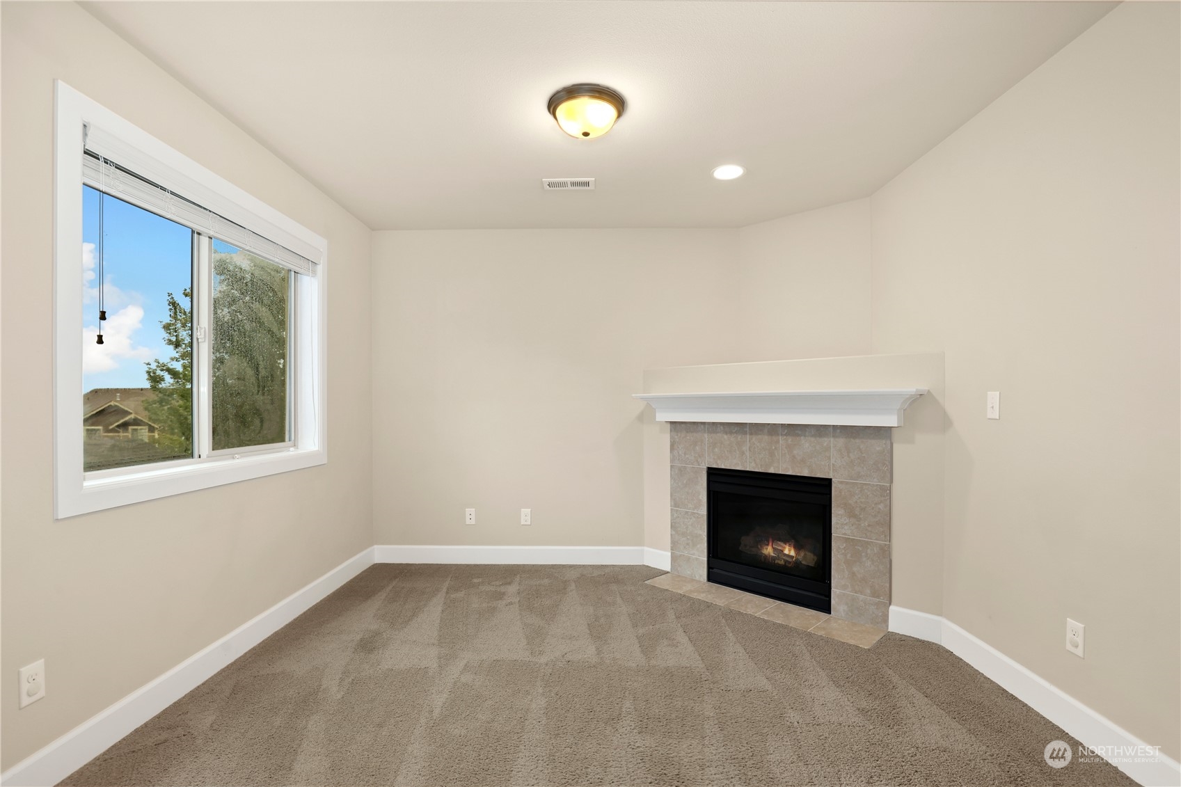 1592 Ridgeview Loop Southwest Tumwater, WA 98512 - Photo 23 of 40 a view of an empty room with a fireplace