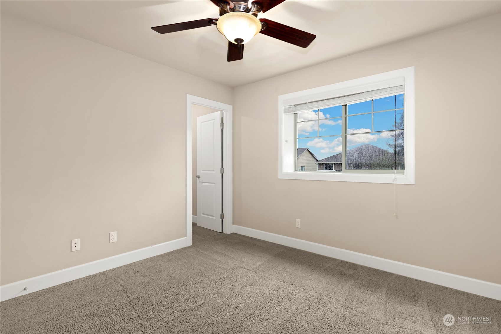 1592 Ridgeview Loop Southwest Tumwater, WA 98512 - Photo 30 of 40 an empty room with a window and a fan