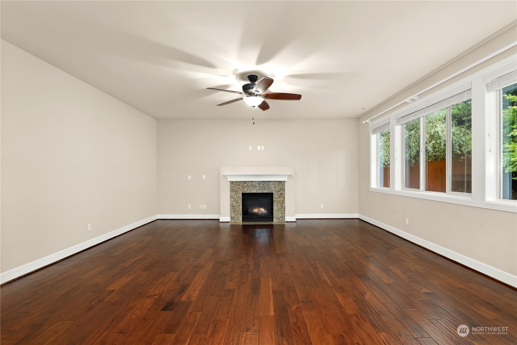 1592 Ridgeview Loop Southwest Tumwater, WA 98512 - Photo 3 of 40 wooden floor in an empty room with a fireplace