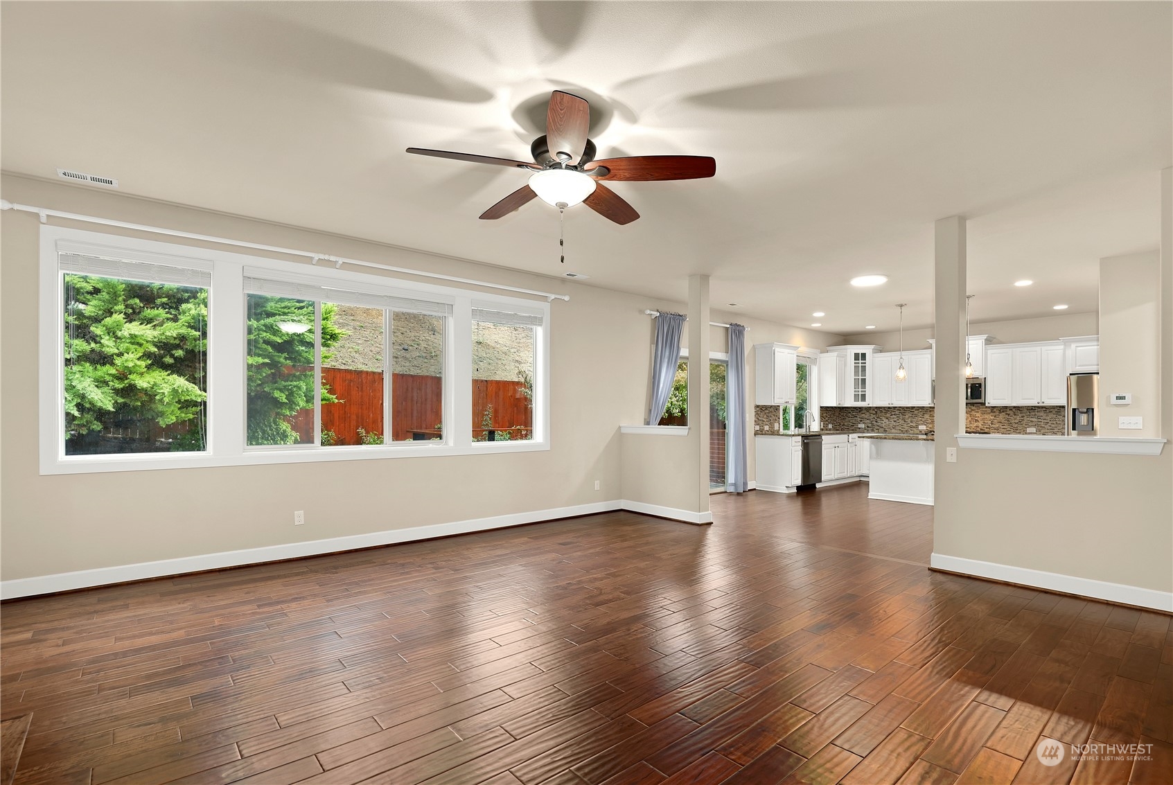1592 Ridgeview Loop Southwest Tumwater, WA 98512 - Photo 5 of 40 a view of an empty room with wooden floor and a window