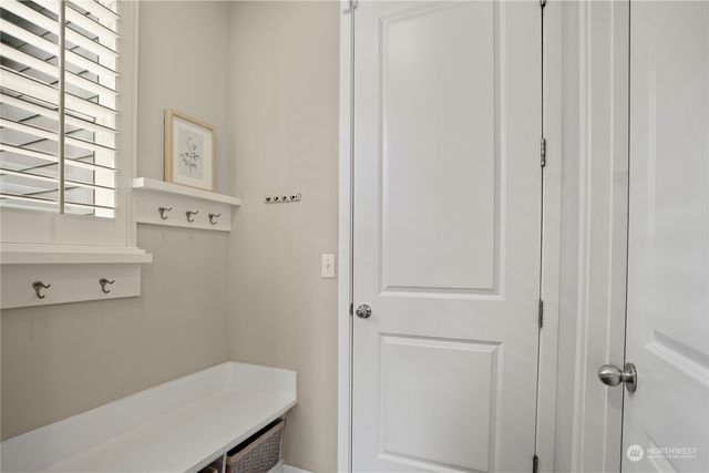 a bathroom with a sink a toilet and a window