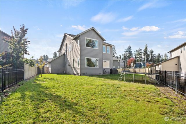 an aerial view of a house with outdoor space