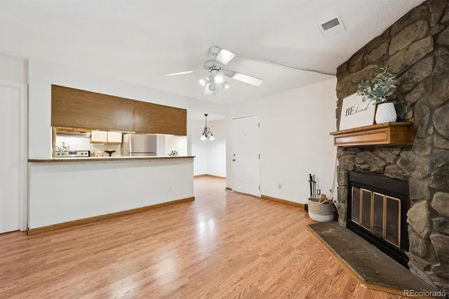 a view of a kitchen with a stove cabinets and wooden floor