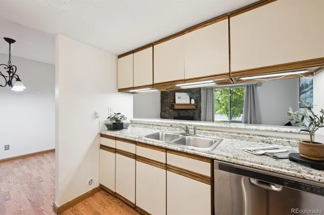 a kitchen with a sink and a window