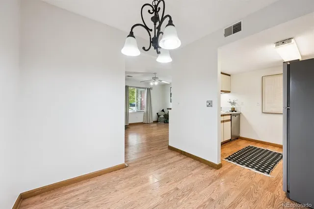 a view of a kitchen from the hallway