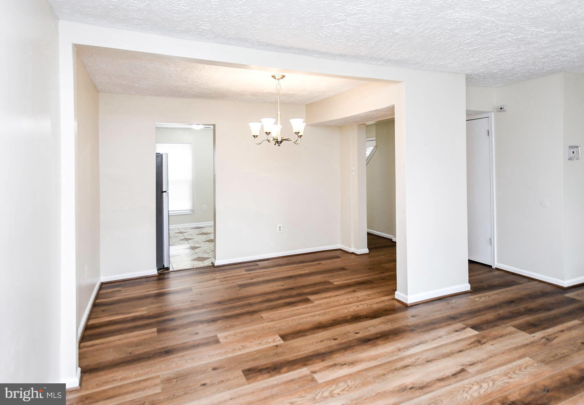 2115 North Anvil Lane Temple Hills, MD 20748 - Photo 13 of 37 a view of a room with wooden floor and stairs