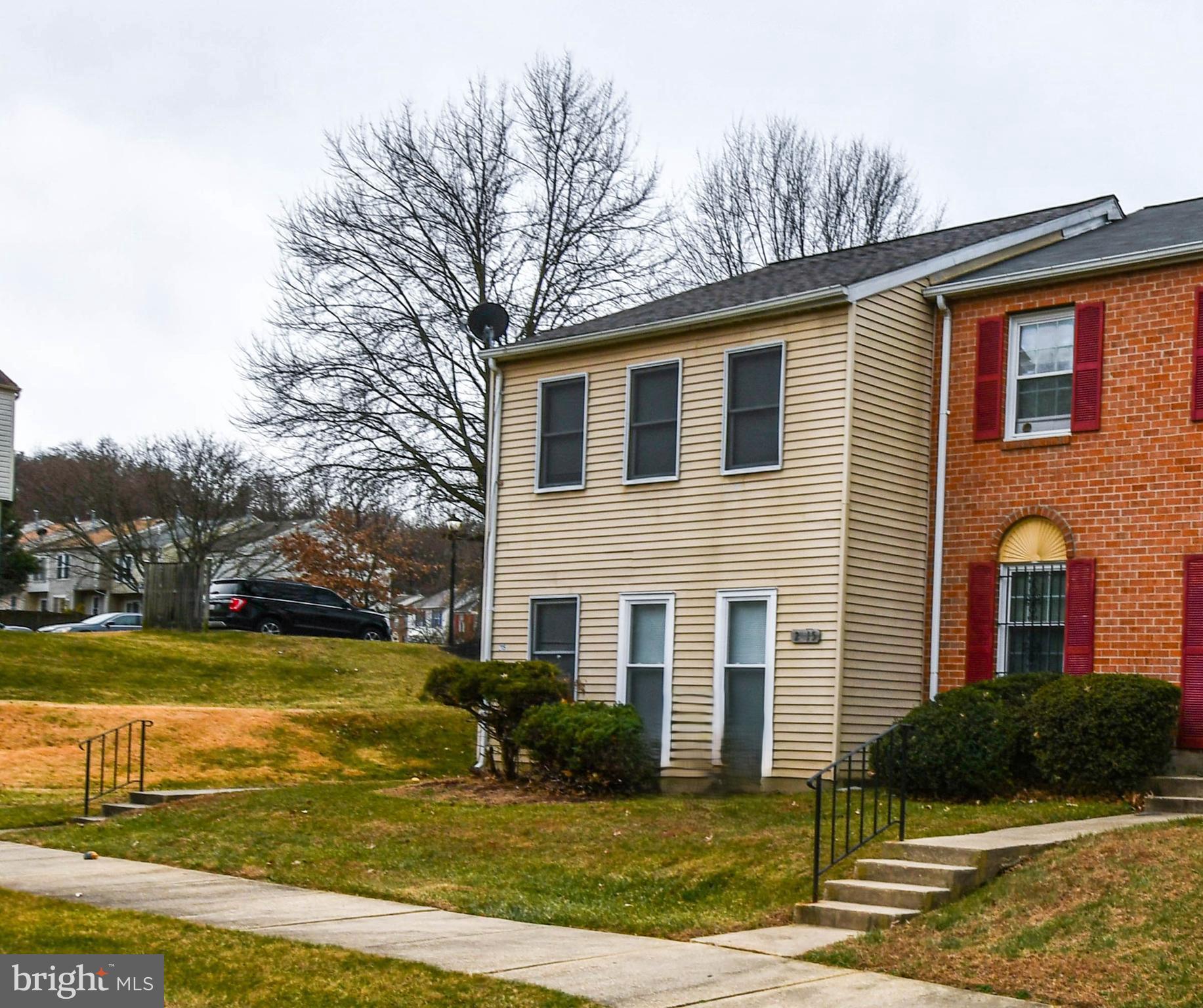 2115 North Anvil Lane Temple Hills, MD 20748 - Photo 2 of 37 a front view of a house with a yard