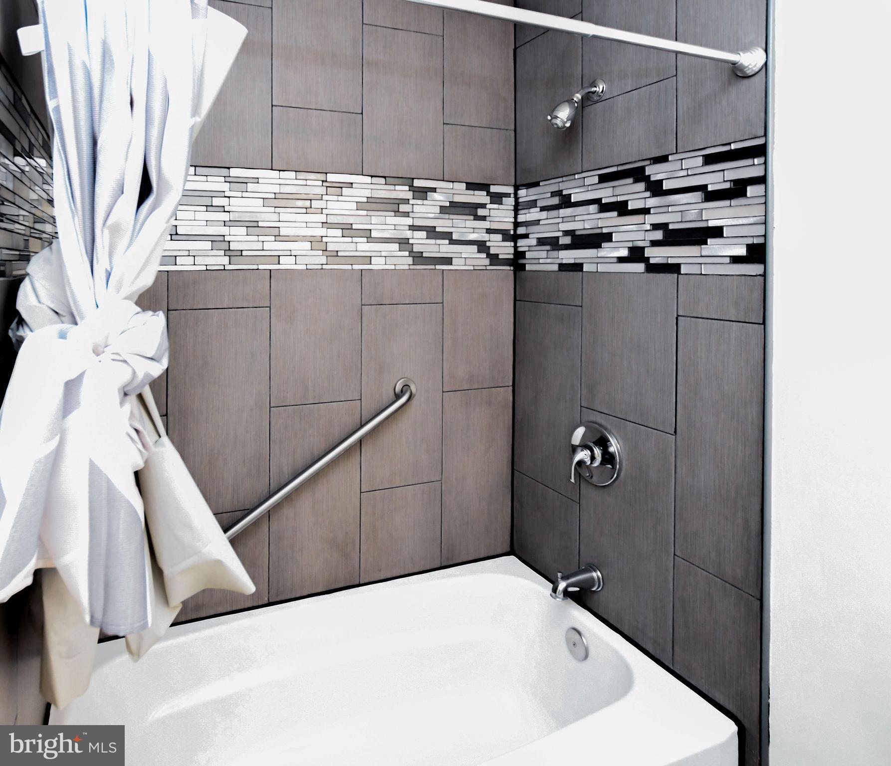 2115 North Anvil Lane Temple Hills, MD 20748 - Photo 25 of 37 a bathroom with a sink and mirror