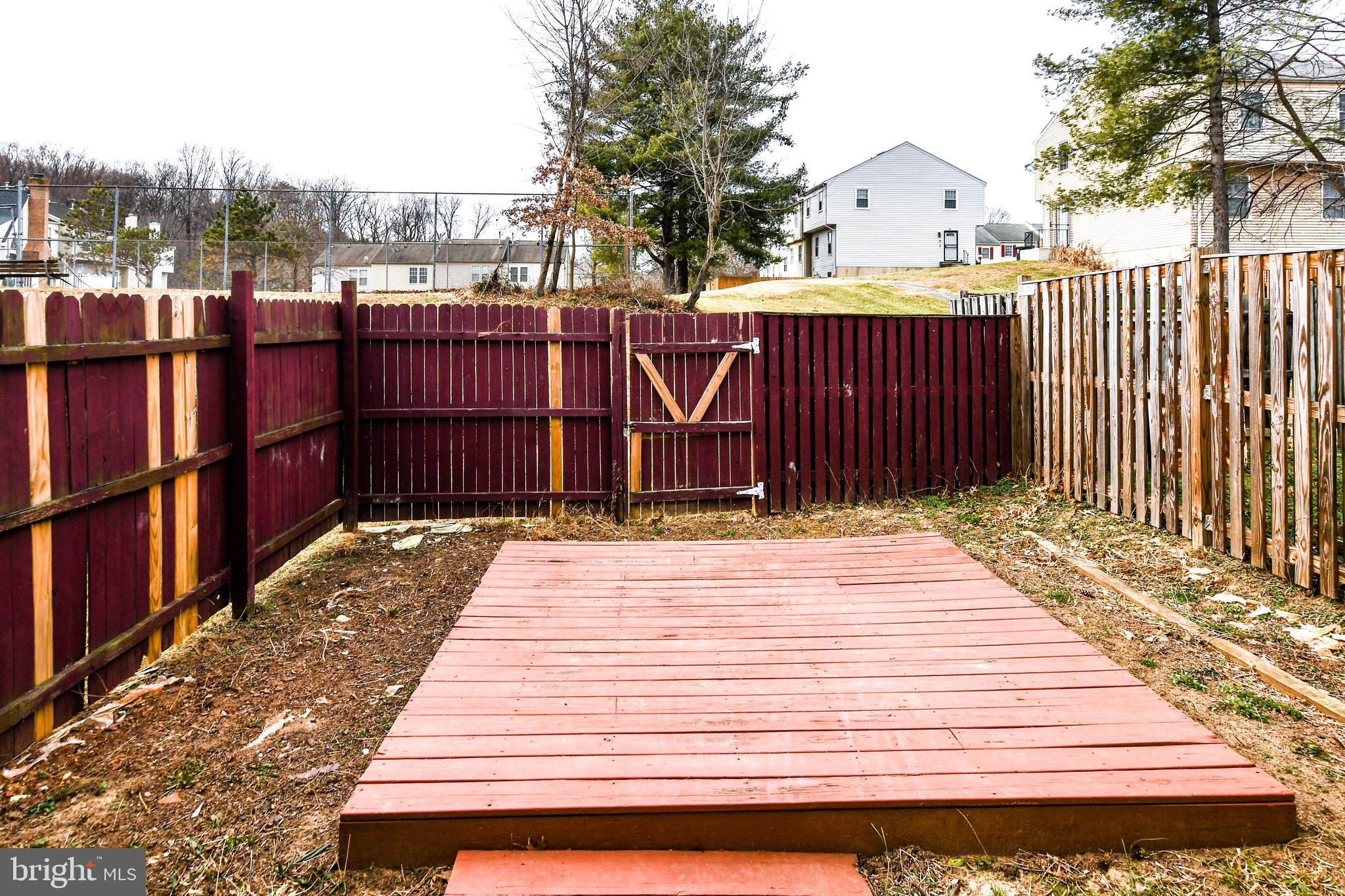 2115 North Anvil Lane Temple Hills, MD 20748 - Photo 36 of 37 a view of a wooden door with a bench