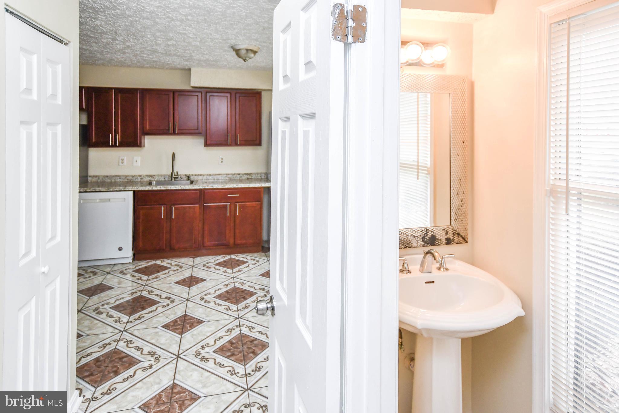2115 North Anvil Lane Temple Hills, MD 20748 - Photo 5 of 37 a bathroom with a sink and a bathtub