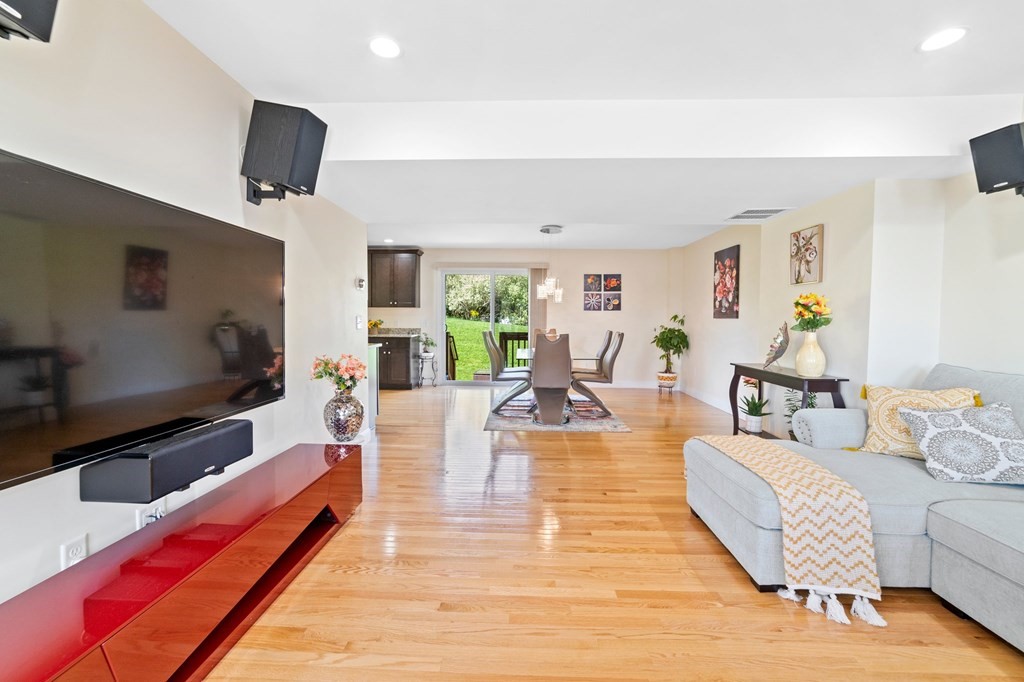 311 Littleton Road, Unit 60 Chelmsford, MA 01824 - Photo 13 of 42 a living room with furniture and a flat screen tv