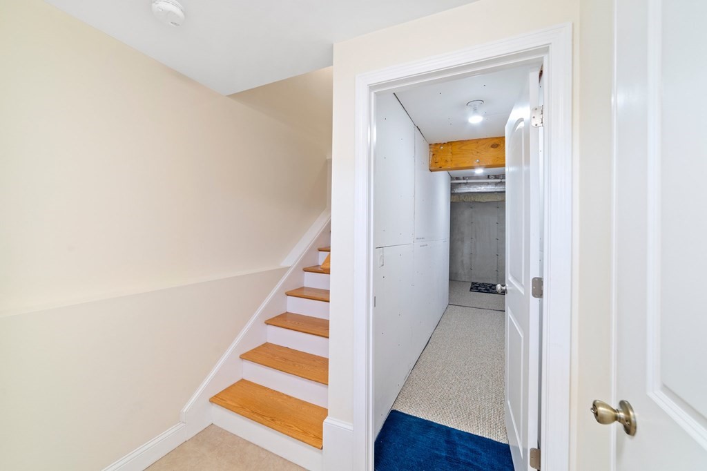 311 Littleton Road, Unit 60 Chelmsford, MA 01824 - Photo 36 of 42 a view of a hallway with wooden floor and entryway