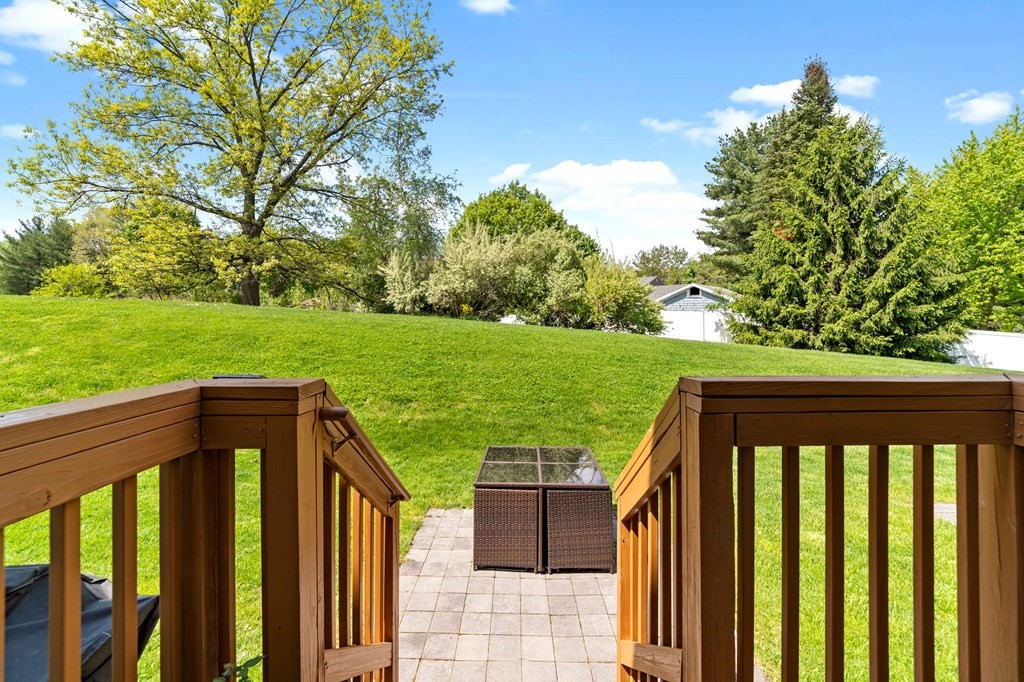311 Littleton Road, Unit 60 Chelmsford, MA 01824 - Photo 39 of 42 a view of a wooden deck and garden