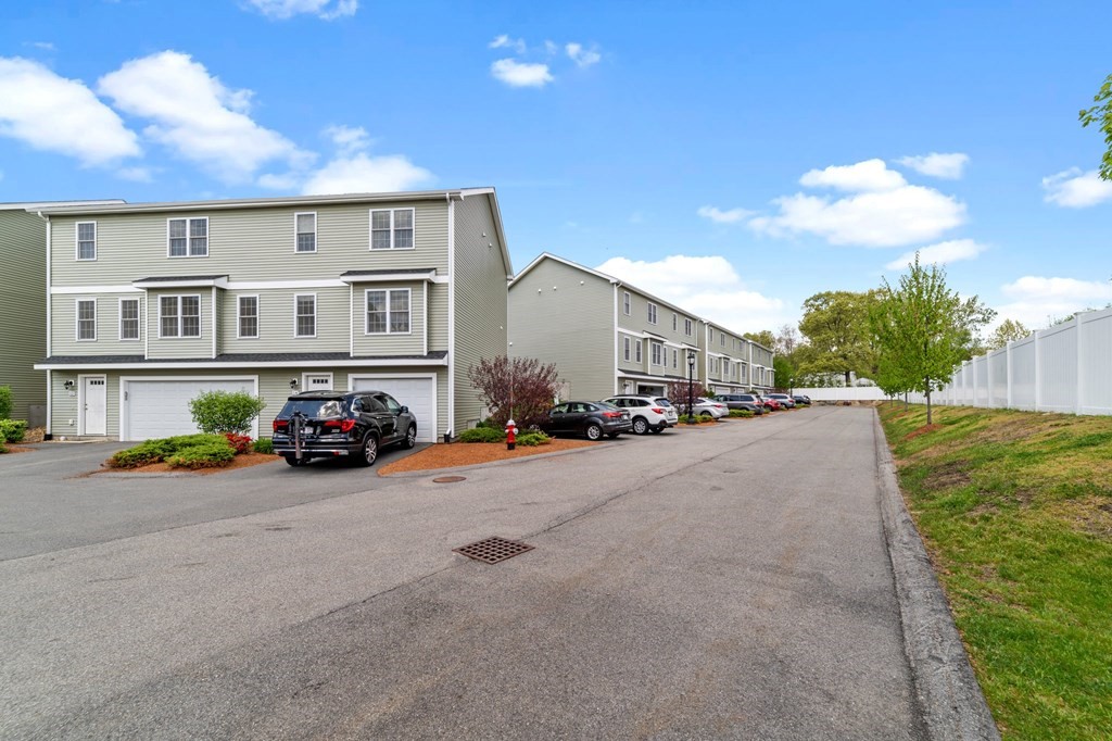 311 Littleton Road, Unit 60 Chelmsford, MA 01824 - Photo 4 of 42 a view of a street with cars