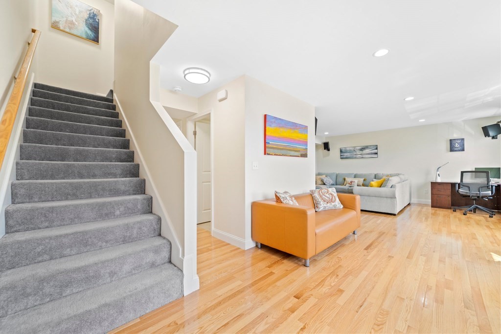 311 Littleton Road, Unit 60 Chelmsford, MA 01824 - Photo 5 of 42 a living room with furniture and a wooden floor