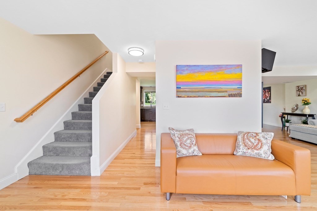 311 Littleton Road, Unit 60 Chelmsford, MA 01824 - Photo 7 of 42 a living room with furniture and a floor to ceiling window