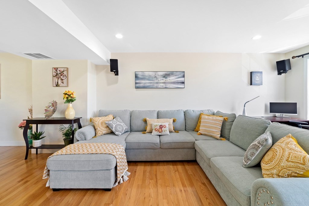 311 Littleton Road, Unit 60 Chelmsford, MA 01824 - Photo 9 of 42 a living room with furniture and a couch