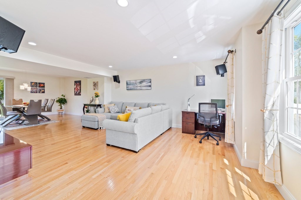 311 Littleton Road, Unit 60 Chelmsford, MA 01824 - Photo 10 of 42 a living room with furniture and a wooden floor