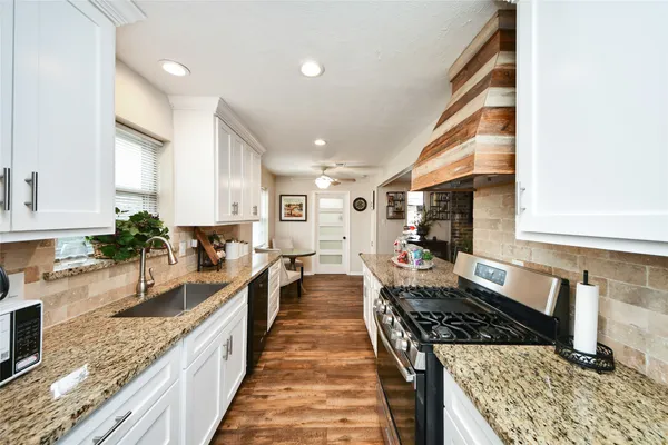 a kitchen with granite countertop lots of counter top space