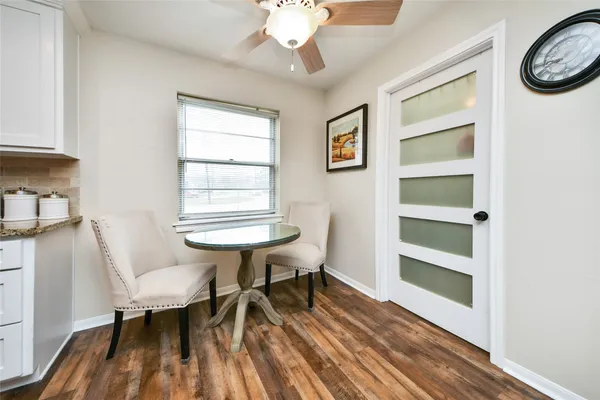 a large white kitchen with lots of counter top space