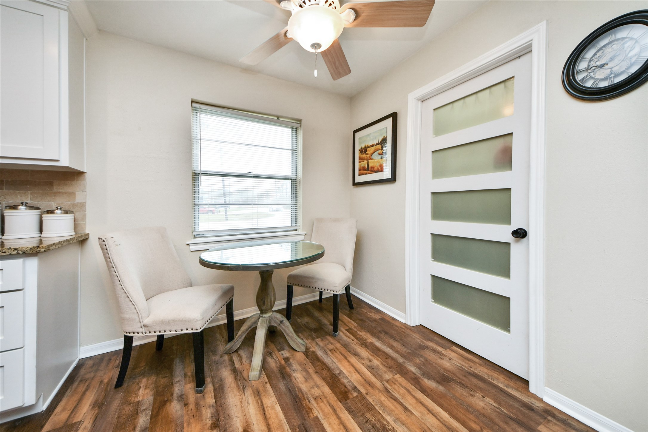 203 Ridgewood Drive Oak Ridge North, TX 77386 - Photo 14 of 39 a workspace with furniture window and wooden floor