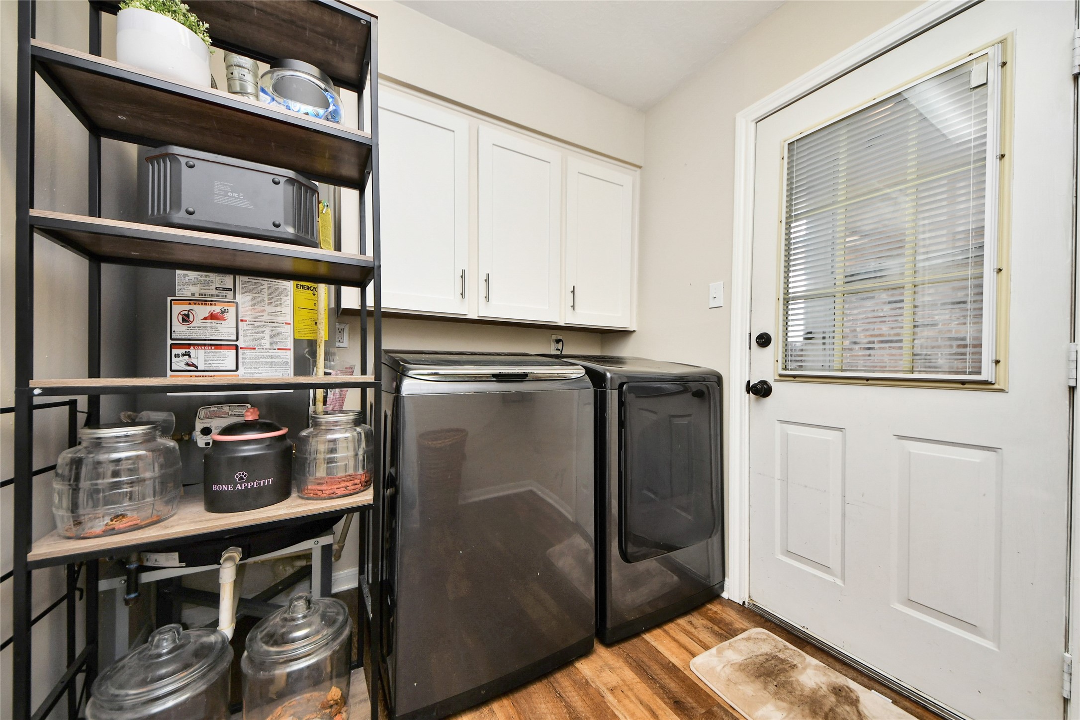 203 Ridgewood Drive Oak Ridge North, TX 77386 - Photo 16 of 39 a kitchen with stainless steel appliances granite countertop a refrigerator and a stove