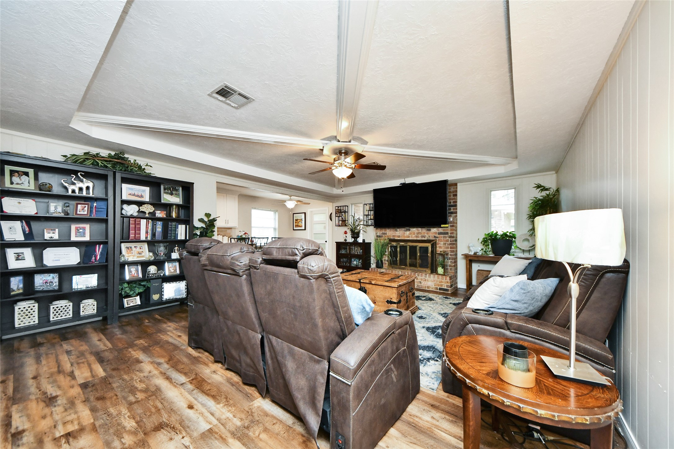 203 Ridgewood Drive Oak Ridge North, TX 77386 - Photo 22 of 39 a living room with furniture and a flat screen tv
