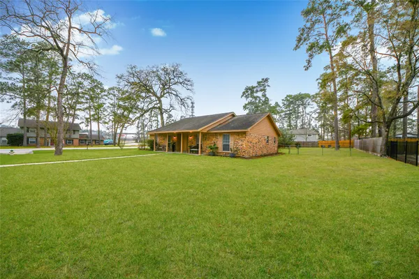 a view of a house with a big yard