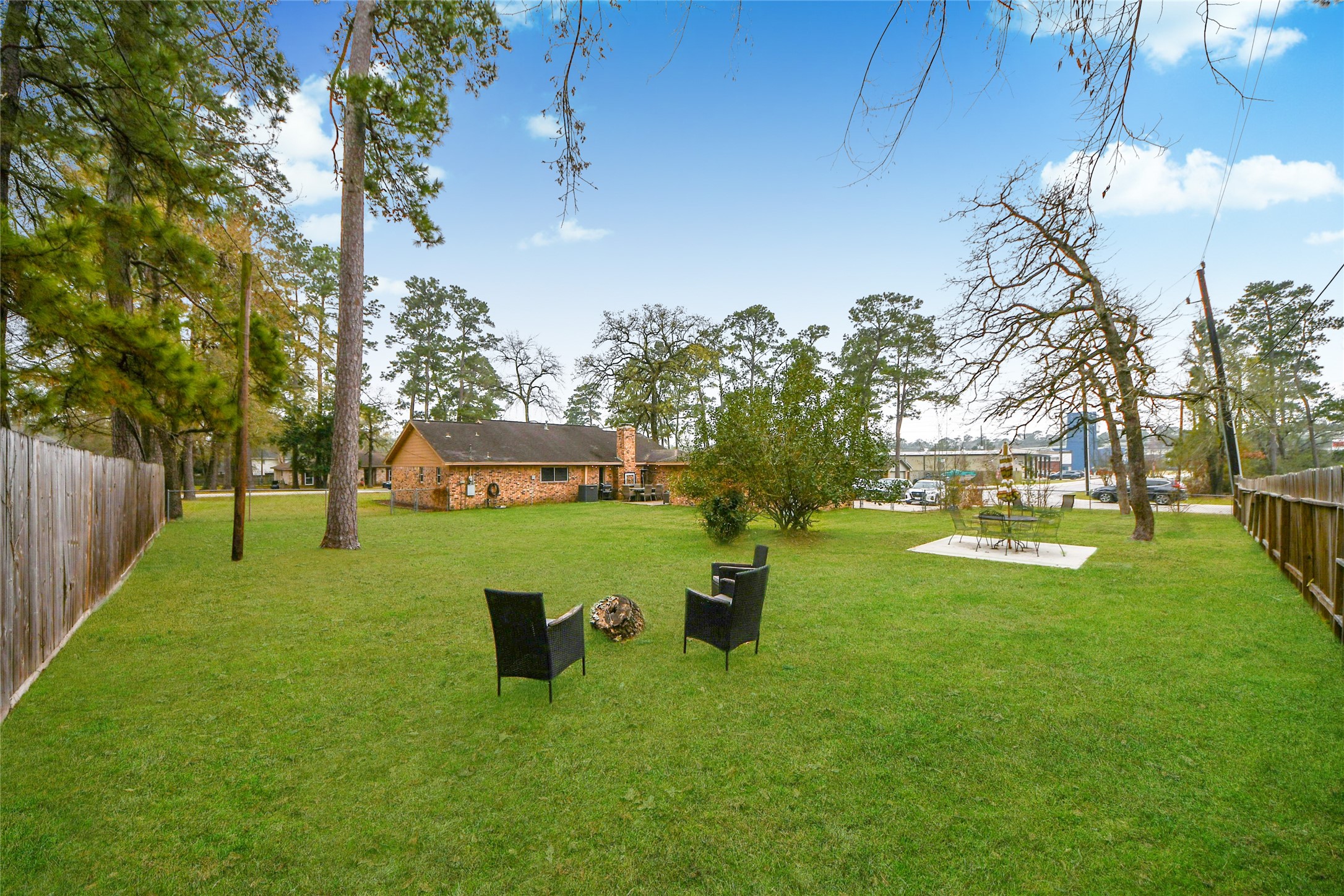 203 Ridgewood Drive Oak Ridge North, TX 77386 - Photo 35 of 39 a view of a garden with a tree