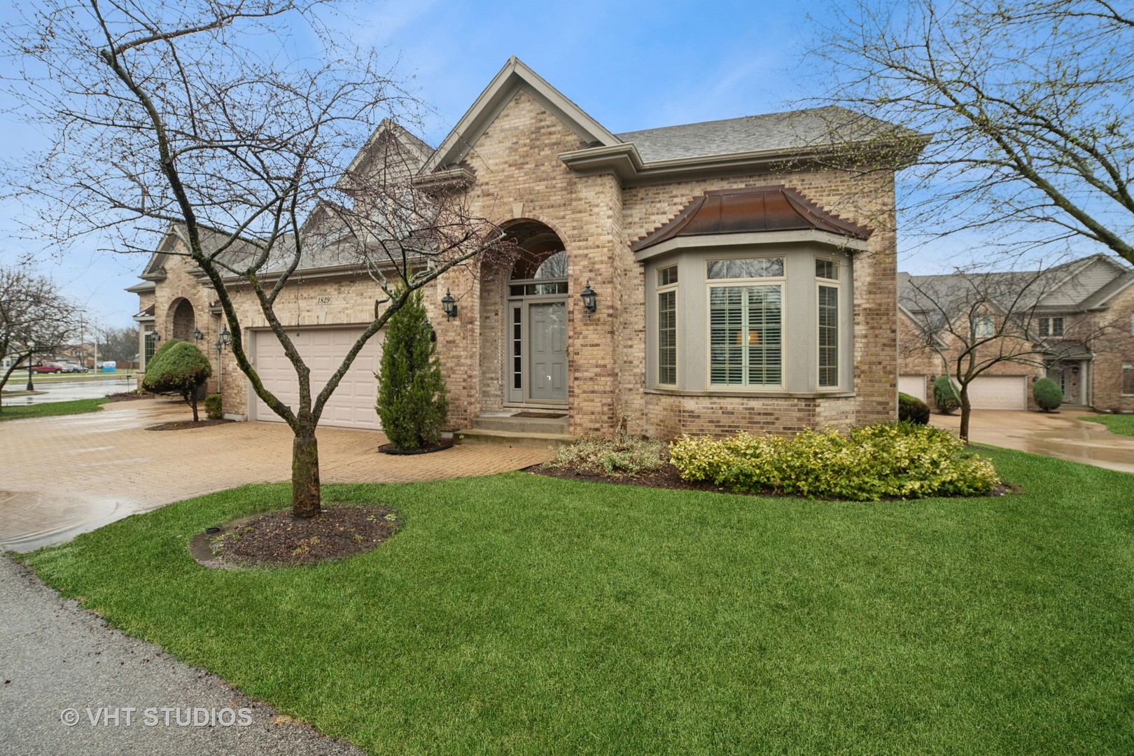 1829 Rizzi Lane Bartlett, IL 60103 - Photo 1 of 37 a front view of a house with garden