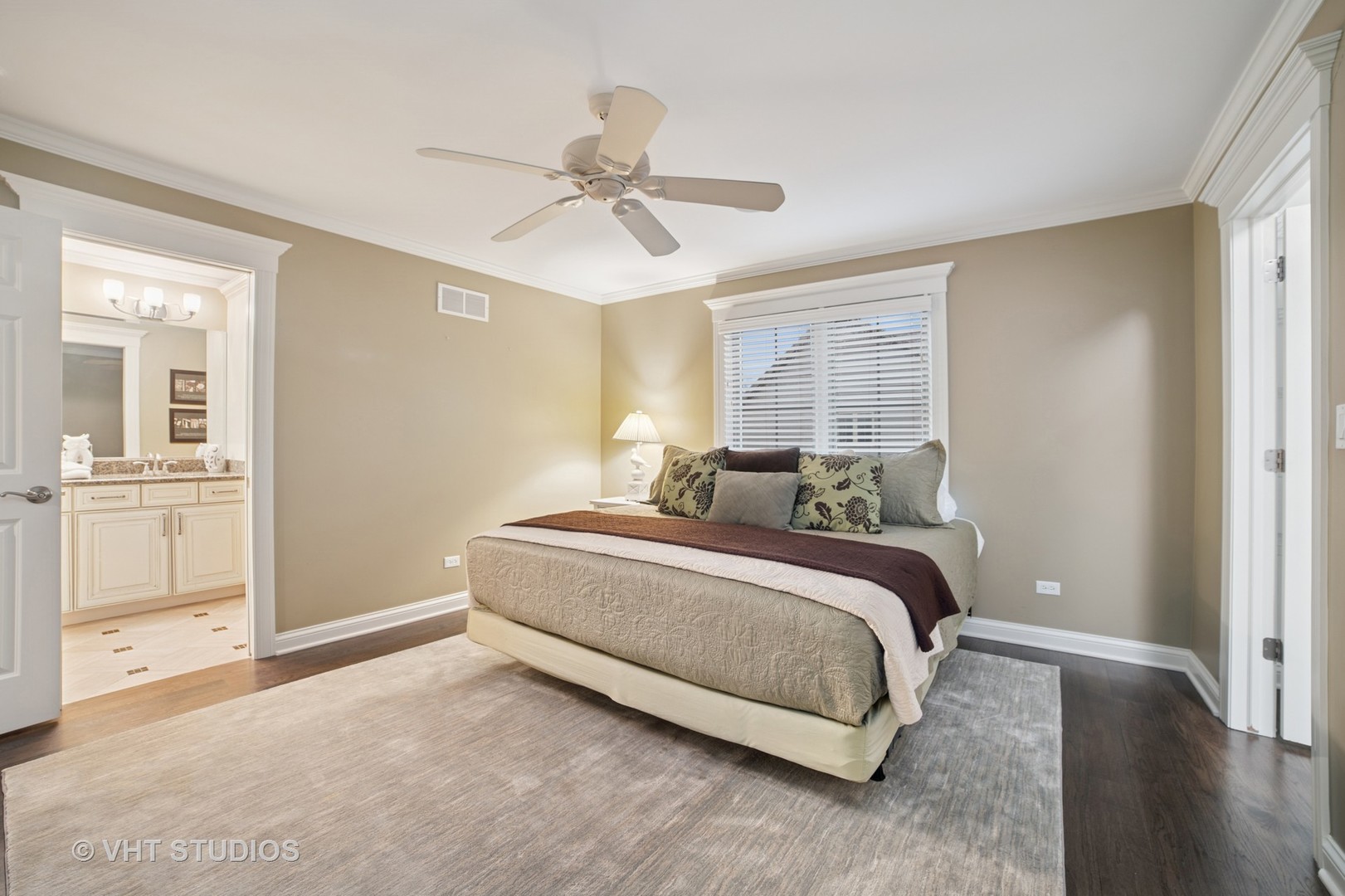 1829 Rizzi Lane Bartlett, IL 60103 - Photo 20 of 37 a spacious bedroom with a bed and a chandelier