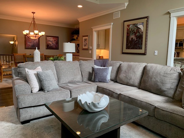1829 Rizzi Lane Bartlett, IL 60103 - Photo 30 of 37 a living room with furniture and a chandelier
